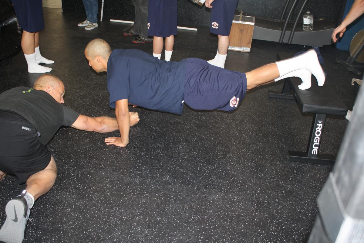 Fire Fighter recruits doing incline pushups