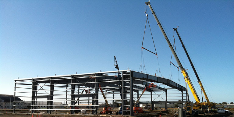 Merdian hanger being built by a large construction crane