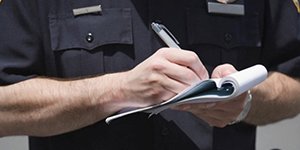 A police officer writing a citation