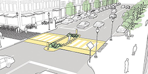 A raised crosswalk at a busy crossing