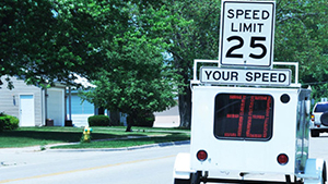 A traffic trailer parked on a residential street