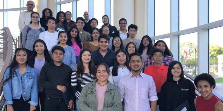 Group of teens and City Council Members posing for a group picture on the stairs at City Hall. (Pre-COVID-19.)