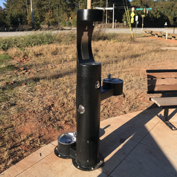 Photo of a refillable water bottle station in a park.