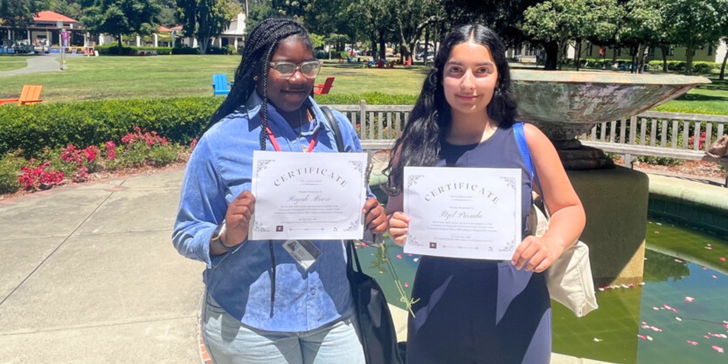 Two Hayward Unified School District students holding their EAROP certificates 