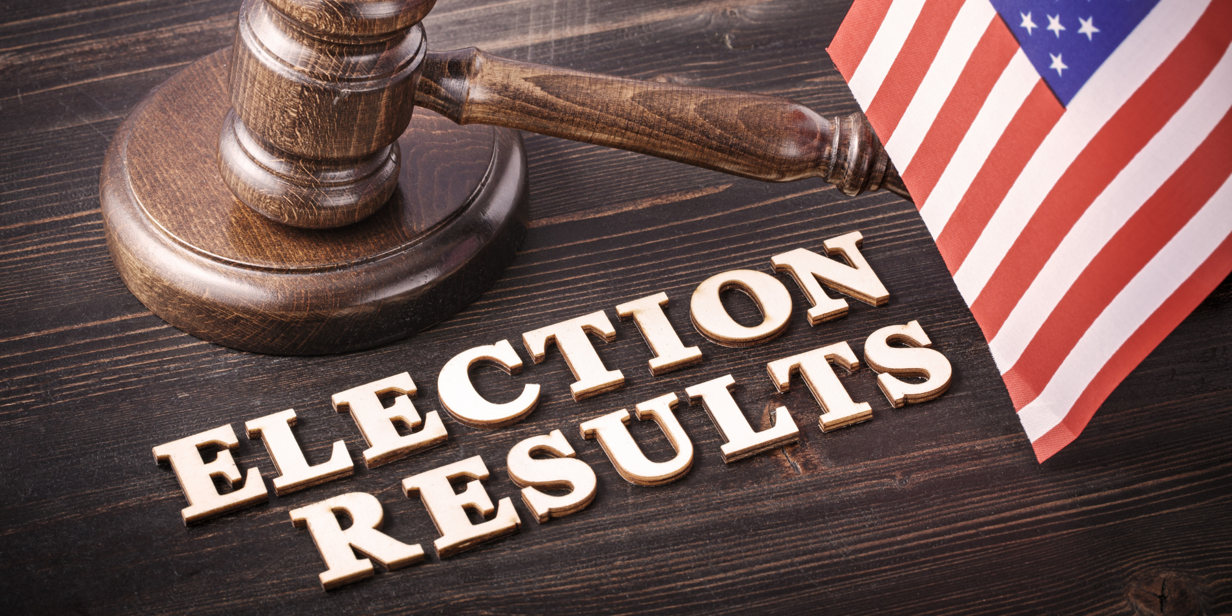 Past Election Information A judges gavel next to an American flag