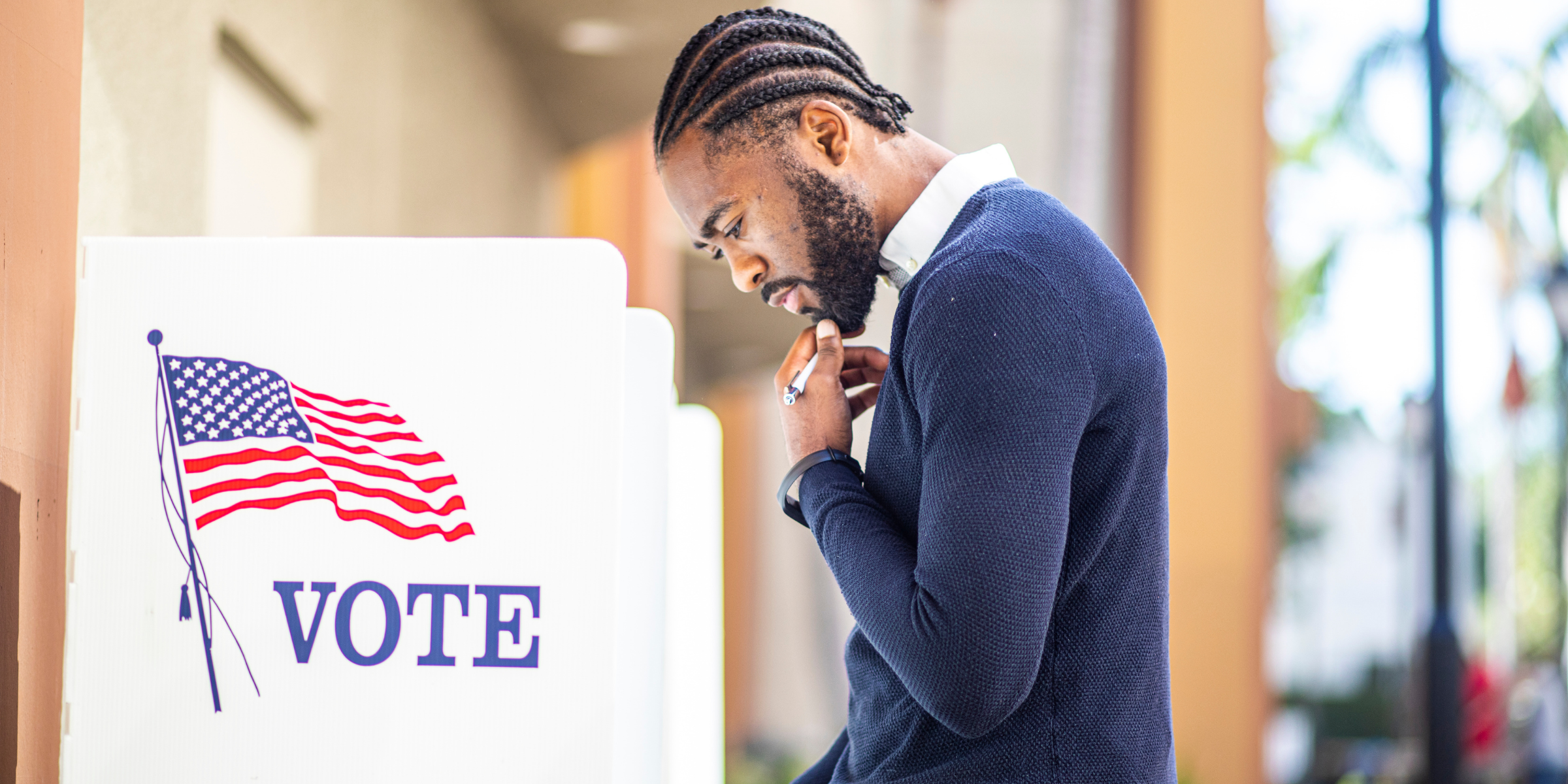 General Voter Information A man standing at an election center