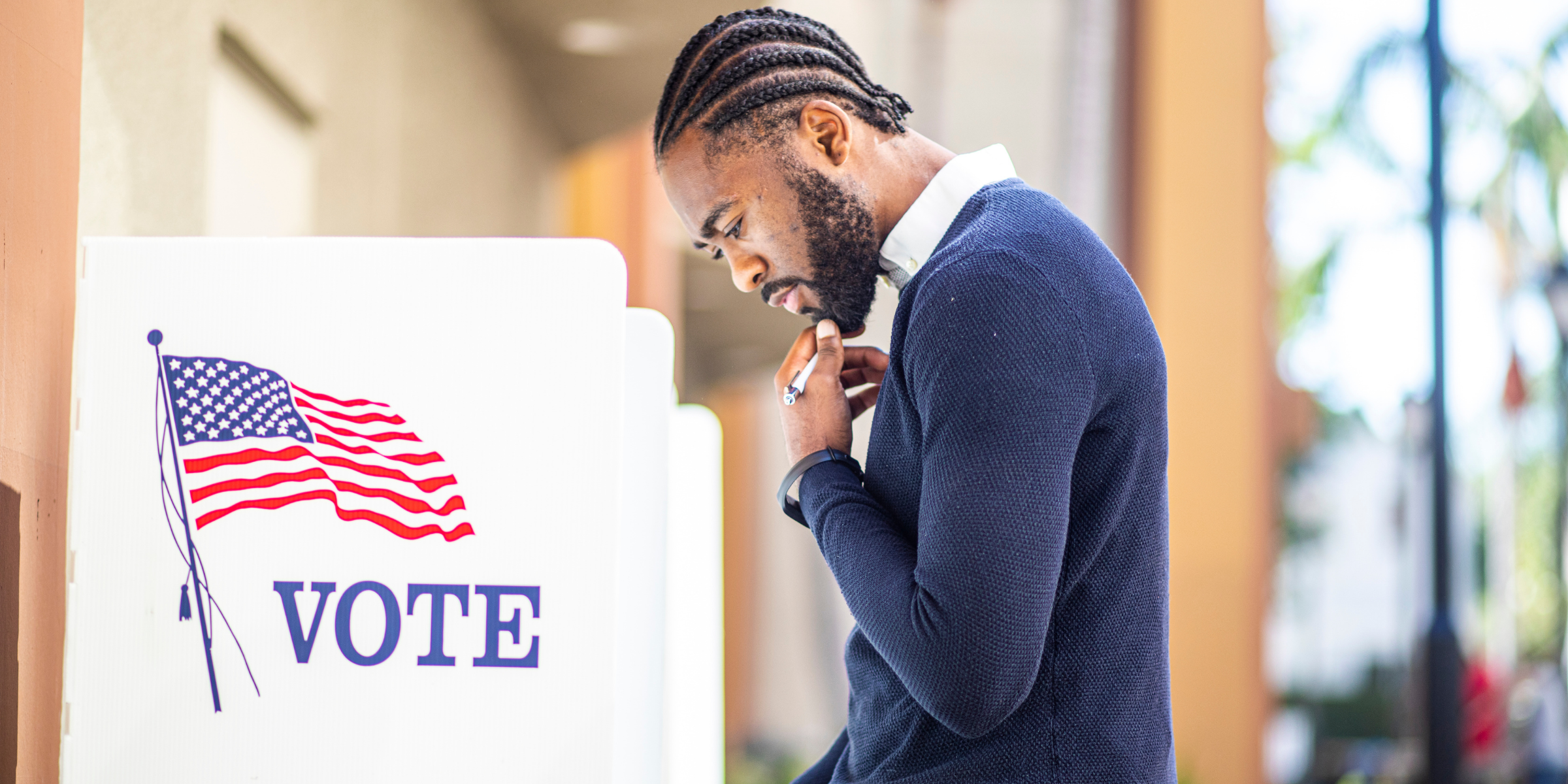 A man standing at an election center