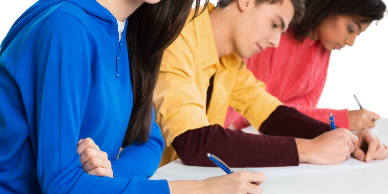 Students writing using pencil and paper