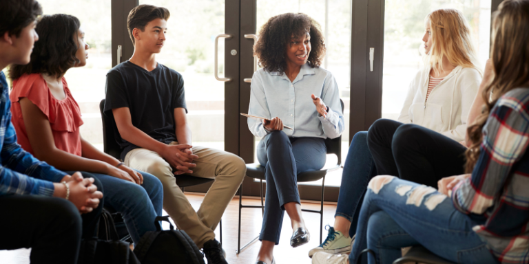 A woman leading an English COnversation Circle