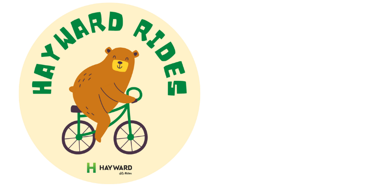 Sustainable Transportation: Hayward Rides & E-Bikes Brown cartoon bear riding a bike with green text that reads: Hayward Rides