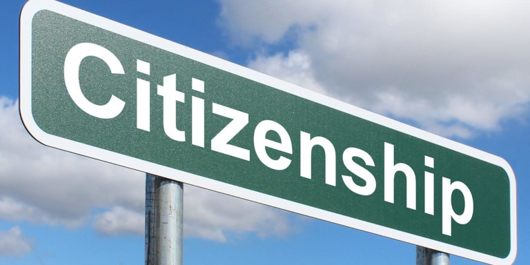 A road sign with the word "Citizenship"