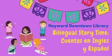 A group of children reading beneath a string of tissue paper flags with the words "Hayward Downtown Library - Bilingual Story Time: Cuentos en Ingles y Español"