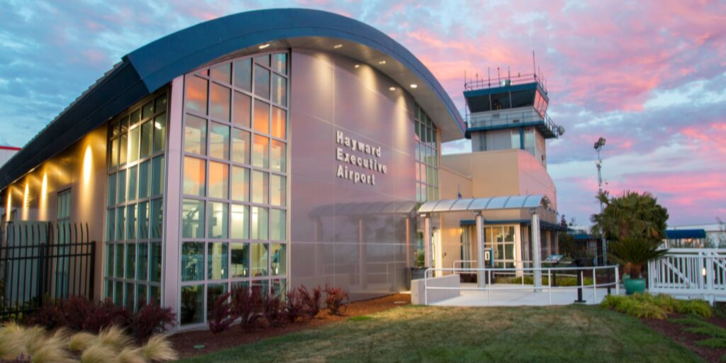 Hayward Executive Airport with a blue and pink sunset