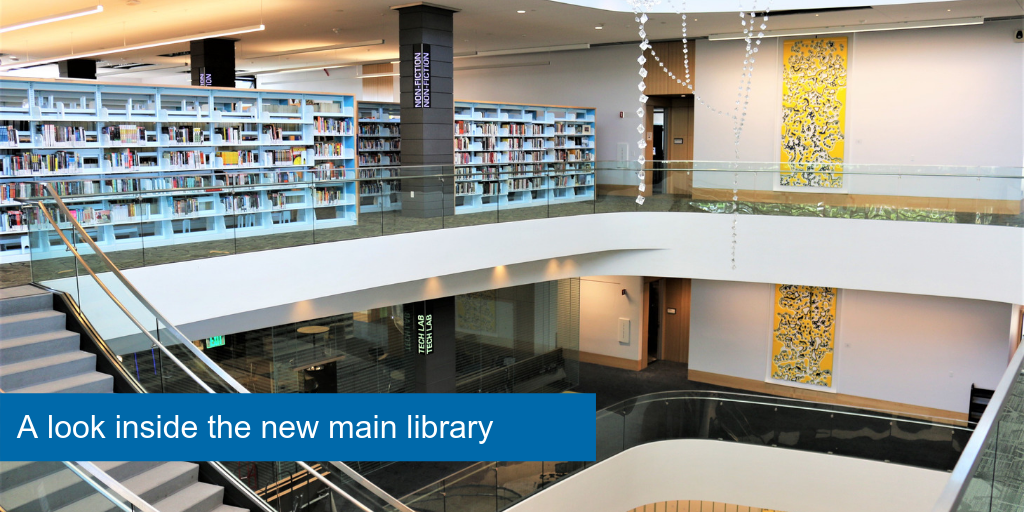 A look from the third floor in the new main library. Books on the shelves and artwork 