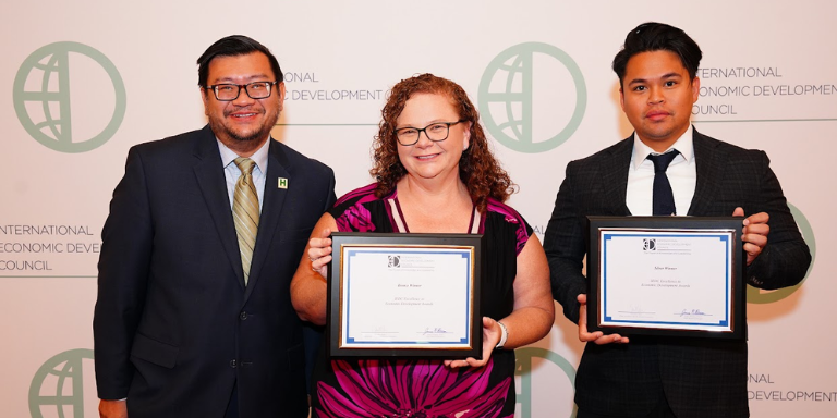 Photo of Economic Development staff holding awards certificates.