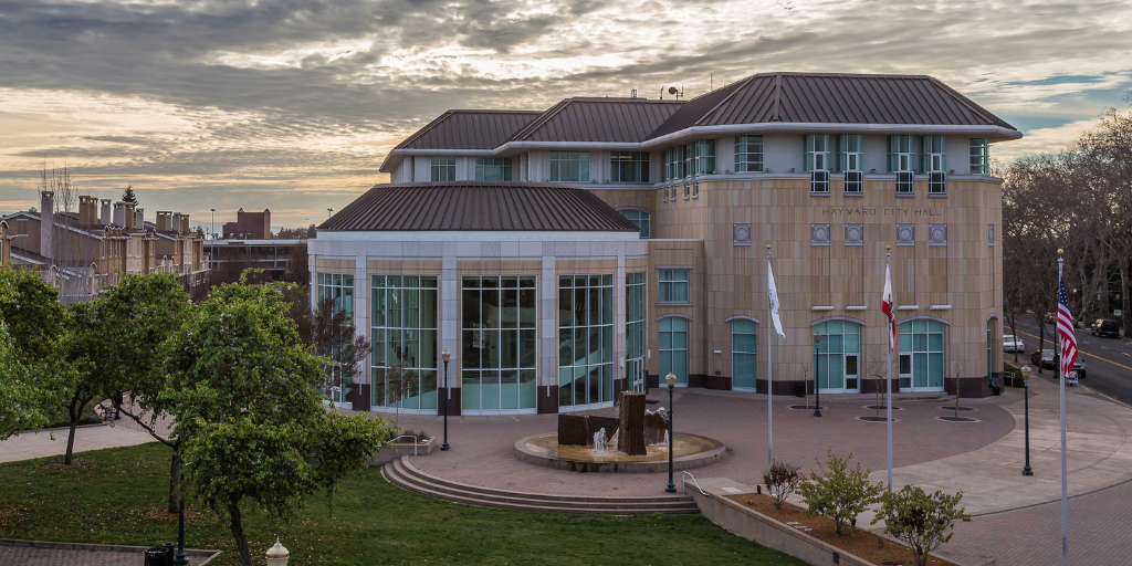 Hayward City Hall on a partly cloudy evening 