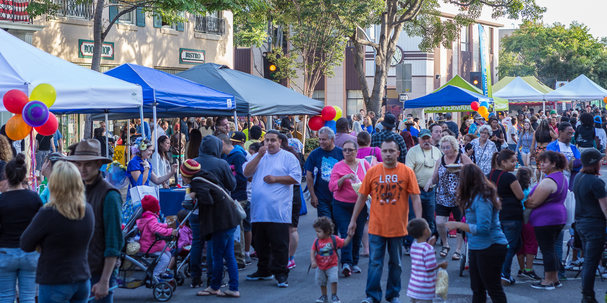 People walking in Downtown Hayward at a previous street party