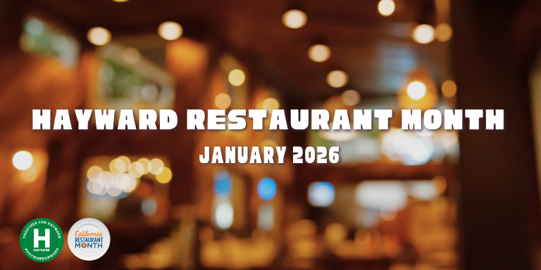 A blurry image inside of a restaurant with the text: Hayward Restaurant Month