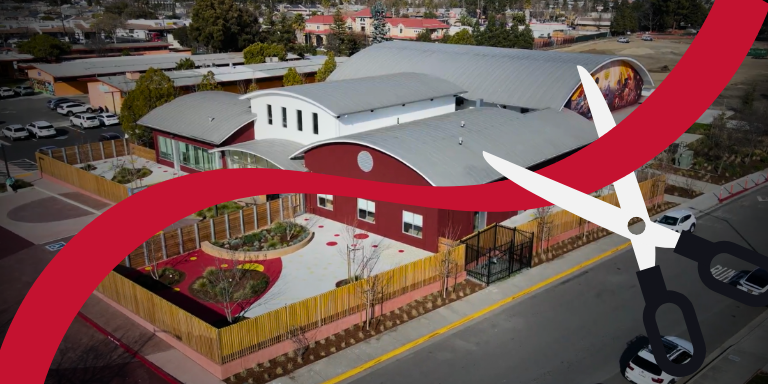 The Stack Center with a red ribbon being cut
