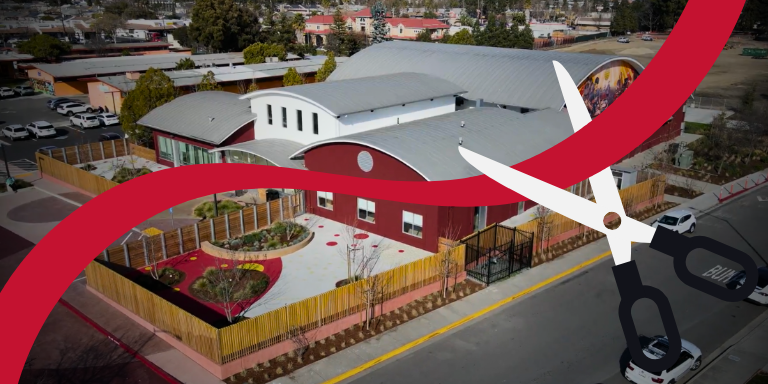 The Stack Center with a red ribbon being cut