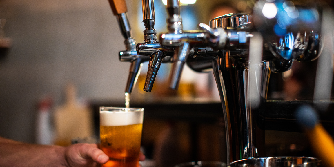 Beer being poured into a glass