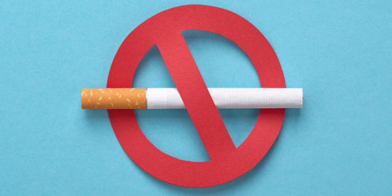 A cigarette with a red no sign threw it 