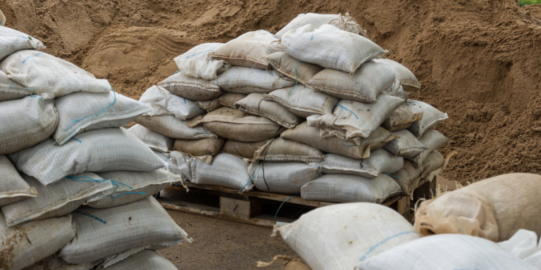 Sand and white sandbags