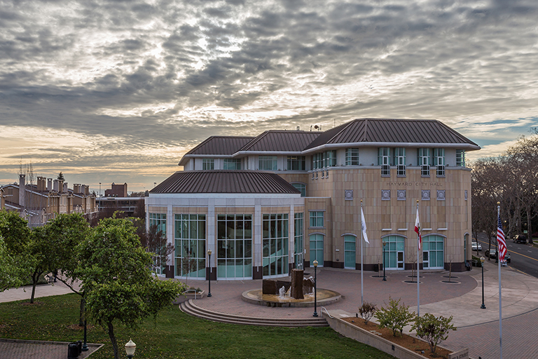 Hayward City Hall on a partly cloudy evening