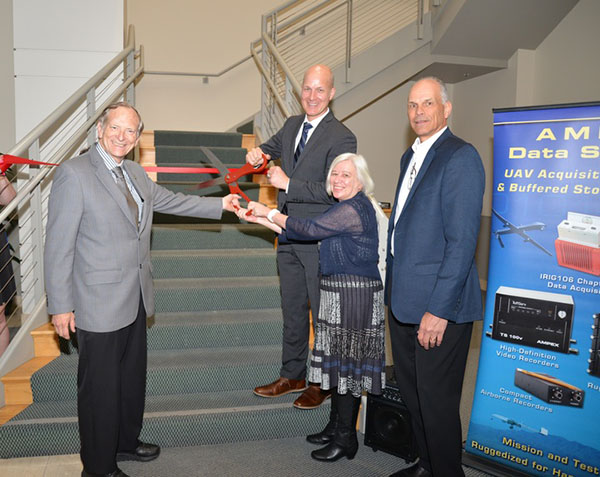 Mayor Halliday and Assemblyman Bill Quirk help employees from Ampex cut the red ribbon