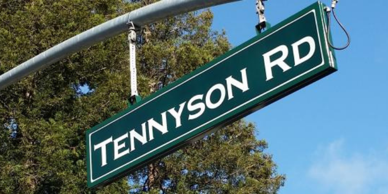 A green Tennyson Road sign