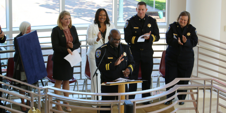 Chief Toney Chaplin smiling and clapping during the ceremony