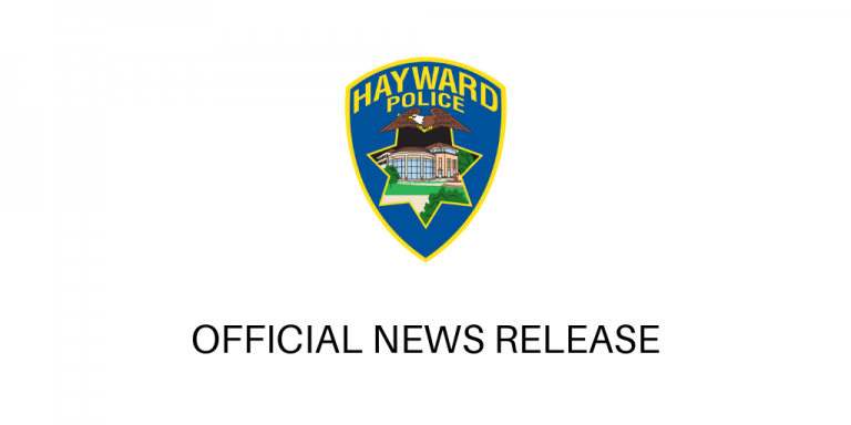 Police shield on a white background above the words official news release
