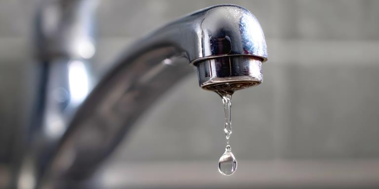 a tap dripping water