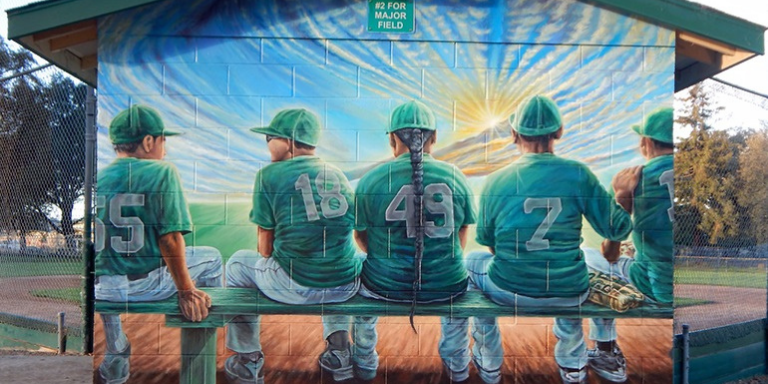 Mural of children sitting in a duguout