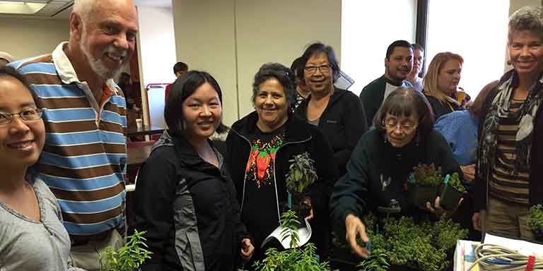 Seed lending and gardening club members meeting at the library